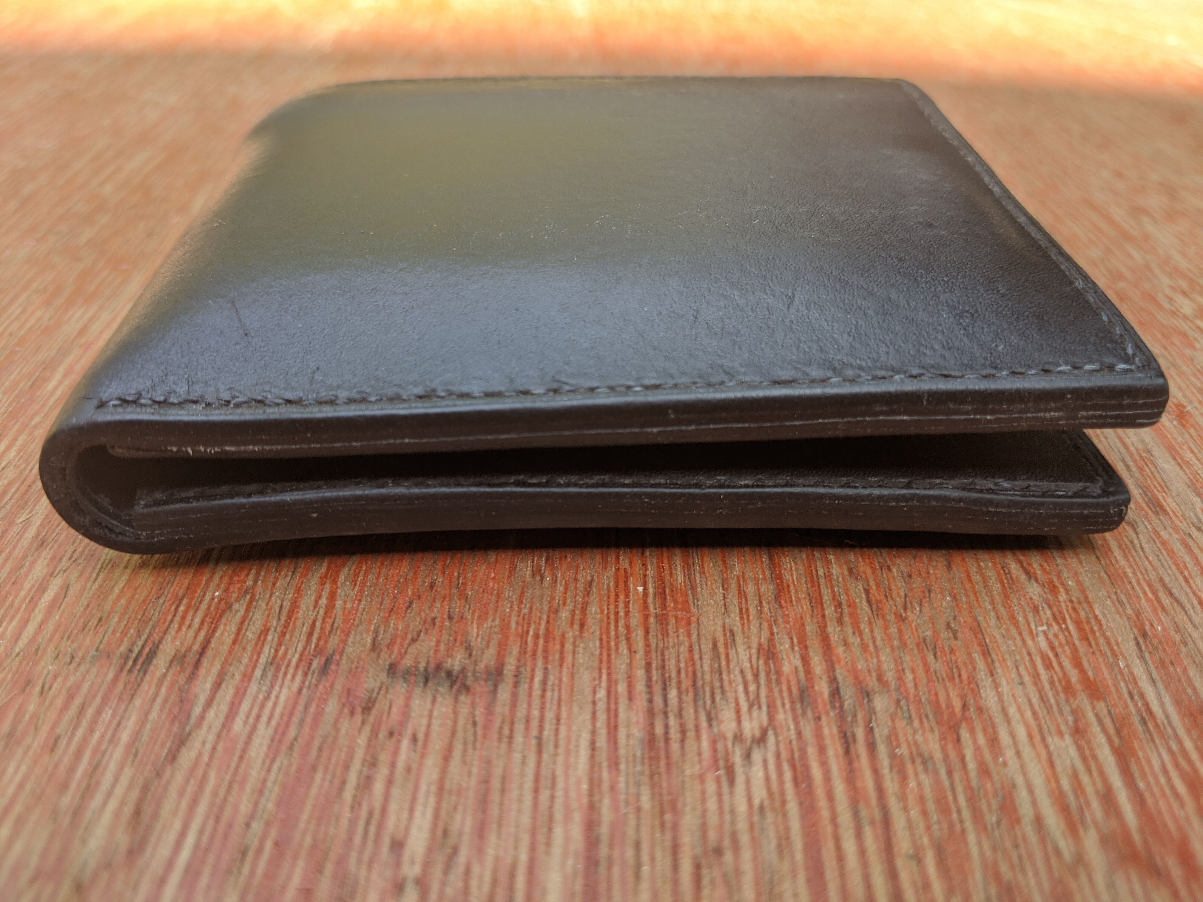 The bottom edges of the wallet.