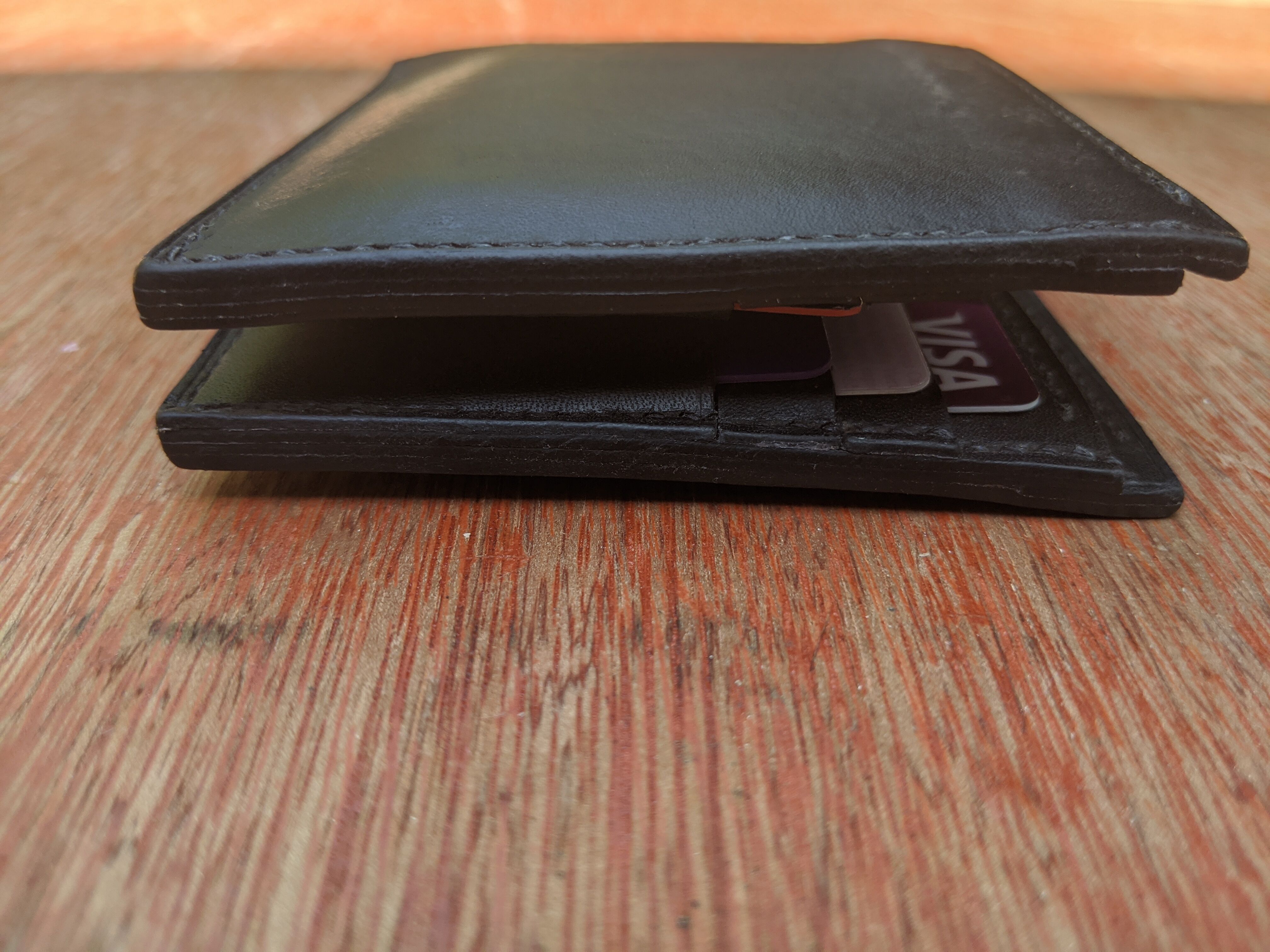 The side edges of the wallet.